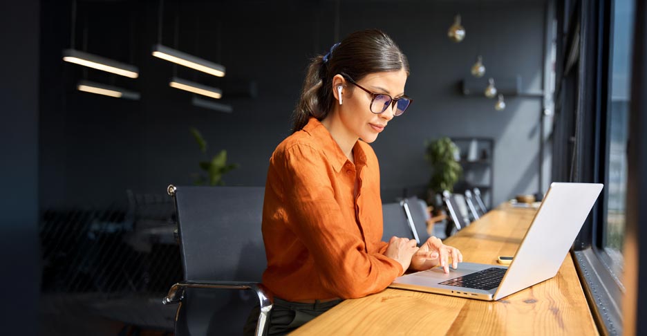 Business professional is working on a laptop.