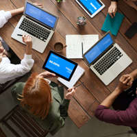 top-view-photo-of-group-of-people-using-macbook-while-3182773.jpg